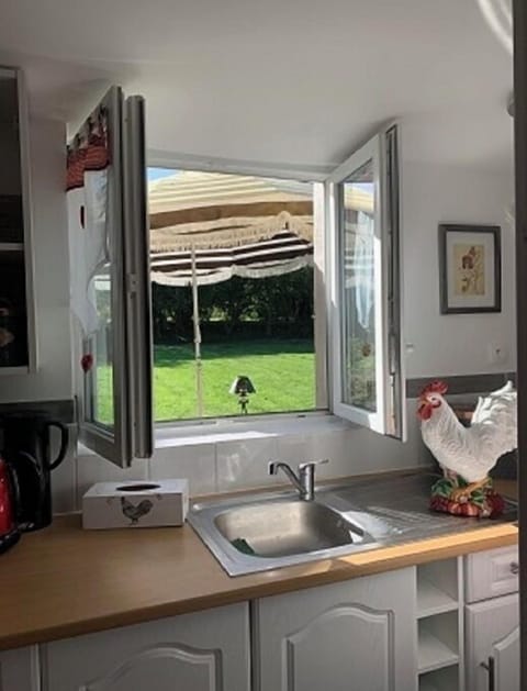 View out of kitchen window on to rear patio area.