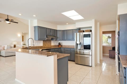 Kitchen area is offering serene view of the pool & ocean
