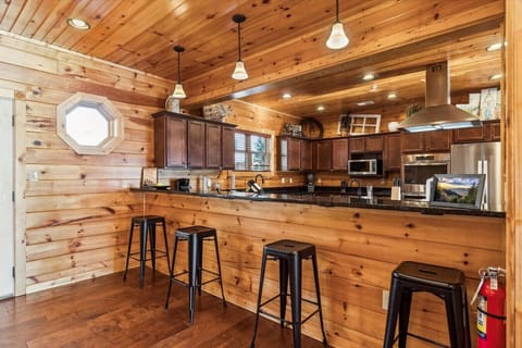 Start your day with a steaming cup of coffee brewed from our espresso machine or coffee maker at the kitchen bar with 4 stools.