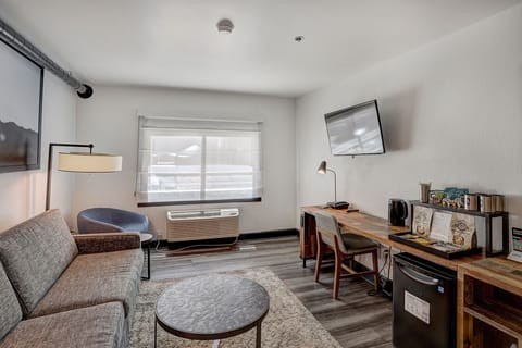 Bright and inviting living space with a comfortable lounge area, perfect for relaxing after a day of adventure.