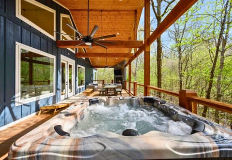 Unwind in style with a soak in the hot tub on your secluded deck, surrounded by the serene sounds of nature