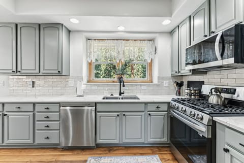 Kitchen with gas range/oven, microwave and dishwasher