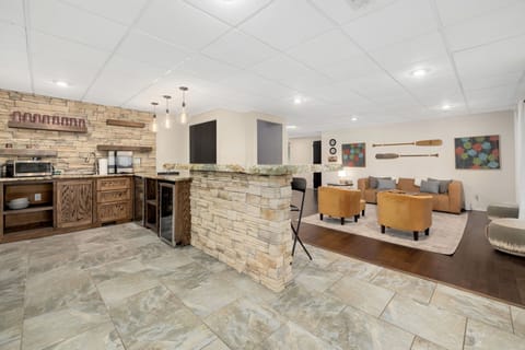 Bar off the living room, fully stocked with 2 wine fridges, an ice maker, wine glasses, and drinking glasses - everything you need for effortless entertaining.