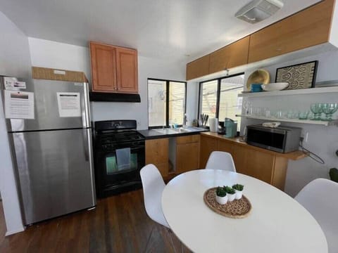 Full size refrigerator, oven and stovetop, microwave, cabinet space, stocked with cooking essentials!