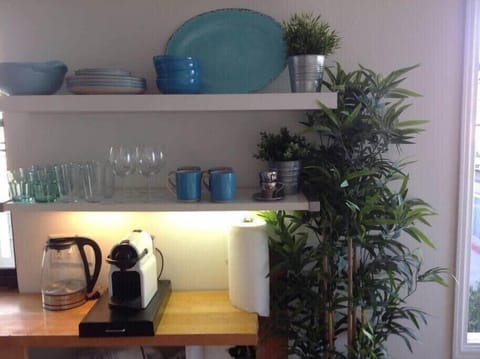 Well stocked kitchen with Keurig machine and coffee pods provided.