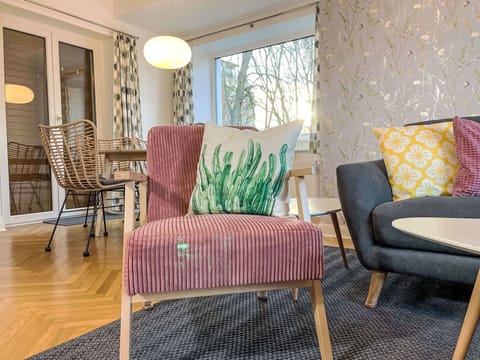 Furniture, Interior Design, Flooring, Floor, Chair, Living Room, Textile, Room, Comfort, Brown