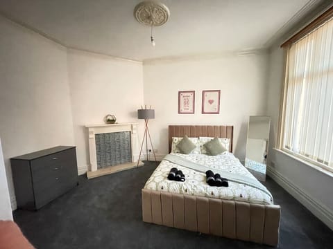 A bright, airy room designed for families, featuring ample space and modern décor for a relaxing stay.