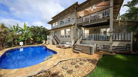 - Relax by the private pool surrounded by tropical palms - Lounge on the stone patio with seating for everyone - End the day in the soothing hot tub under the sky