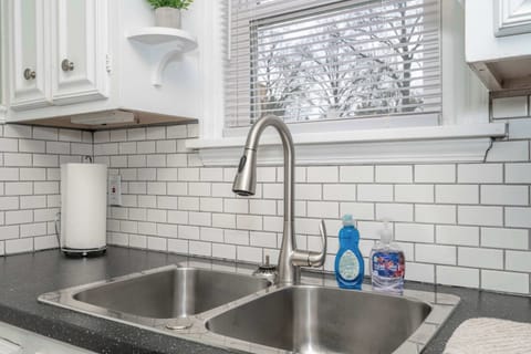 The serene kitchen is well equipped with everything needed for a great stay