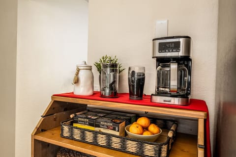 Enjoy our complete coffee bar with grinder, french press, teas and snacks.