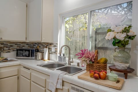 Well-equipped kitchen with cookware, spices and everything needed for cooking.