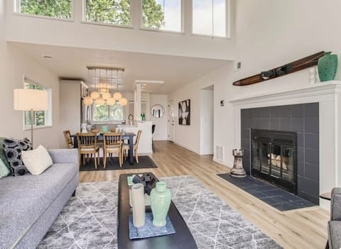 Living room looking toward kitchen.  upper windows give the condo amazing light.