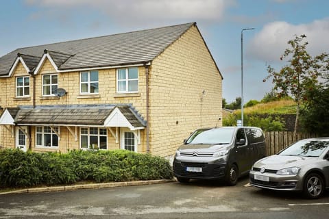 [Exterior] Quiet end townhouse with private parking for two vehicles