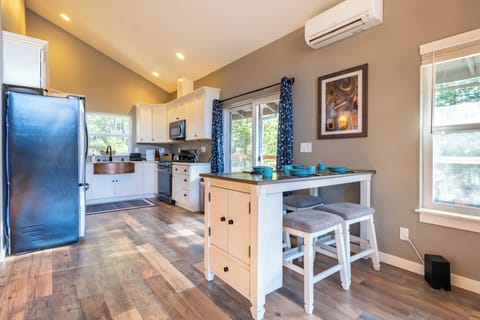 Fully equipped kitchen with a cozy dining set for four.
