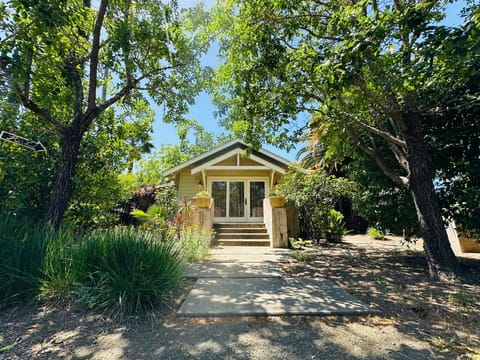Myrtledale Bungalow is tucked among mature trees and thoughtful landscaping.