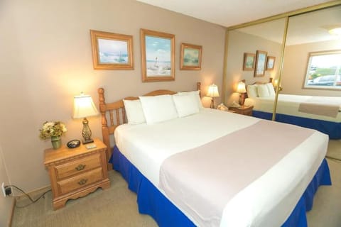 Unwind in crisp linens and soft, lamp-lit comfort.