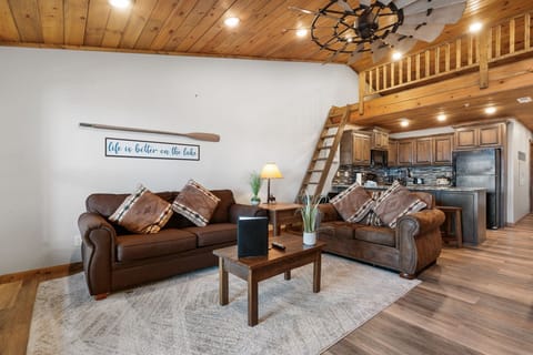 Living Room with Cable TV, Fireplace, Various Board Games, Sleeper Sofa, Loft, and Deck Access