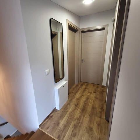 Second-Floor Hallway with Access to Cozy Bedrooms – Modern Interior