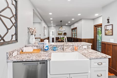 Spacious kitchen with farm-sink and dual dishwasher.