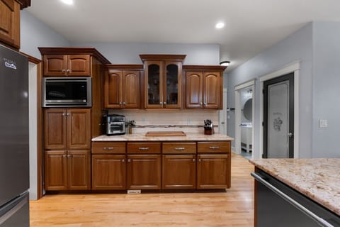 Spacious kitchen perfect for meal prep, entertaining guests, or simply reheating leftovers—flexible and fully stocked for every kind of stay.