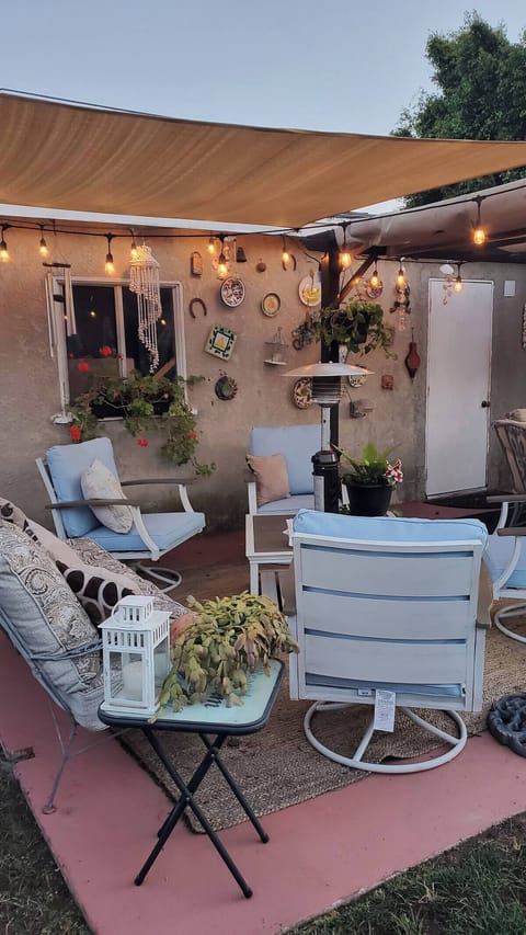 At sunset, unwind on the patio by the pool and enjoy a glass of wine by the fire