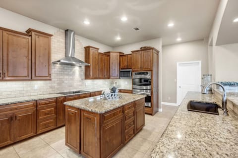 Kitchen includes double ovens, cooktop, two microwaves and two dishwashers