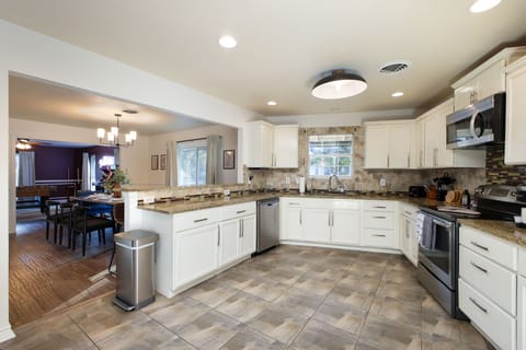 Featuring ample cabinetry, high-end appliances, and everything you need to whip up delicious meals! 