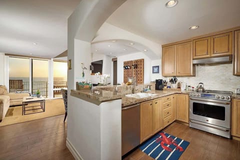 Fully stocked open chefs kitchen with ocean views 