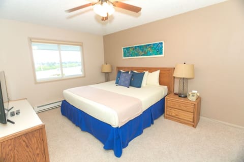 Unwind in a bright bedroom with fresh linens.