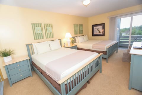Unwind in a bright bedroom with two comfy beds.