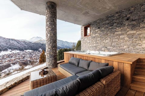 Covered seating area with the 9 seater hot tub by Wellis.