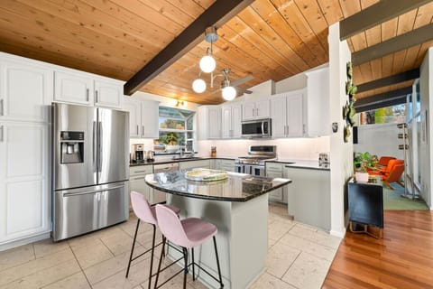 Fully equipped kitchen with island seating and everything you need to cook and entertain. Ready for your culinary adventures!