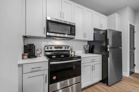 The fully equipped kitchen features sleek, modern appliances and ample counter space, making it easy to prepare your favorite meals. Whether you’re brewing a morning coffee or eating in. You will have everything you need to make your favorite meals.