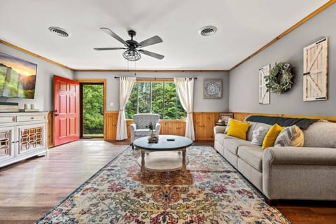 A living room designed for comfort and style, featuring elegant furnishings and a bright, inviting ambiance.