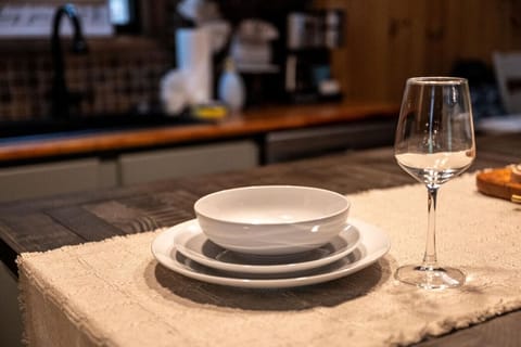 Thoughtfully set for your stay, this dining space offers cozy touches that make every meal feel special, whether it's a morning coffee or a candlelit dinner.