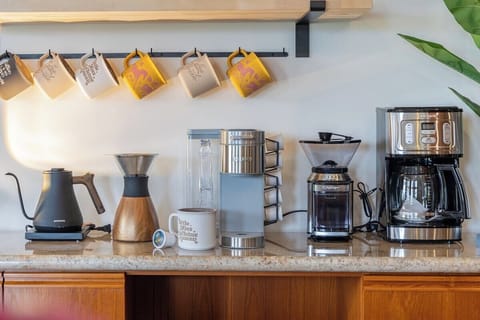 Fully equipped kitchen featuring a convenient coffee station with a coffee maker to start your mornings right.