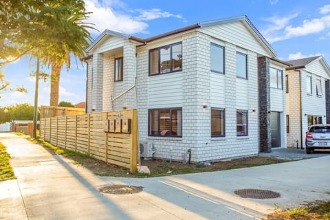 The townhouse is set amongst other townhouses in this quiet residential street.