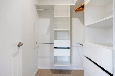 There is plenty of storage in the walk-in wardrobe.