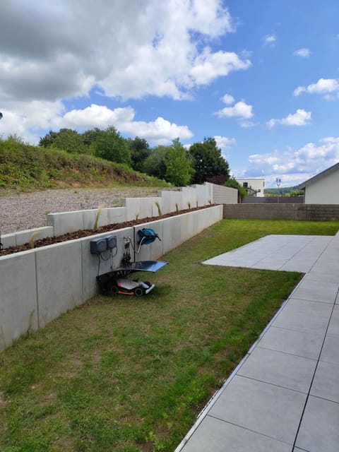 Private garden area with windows to the living room, study and bedroom