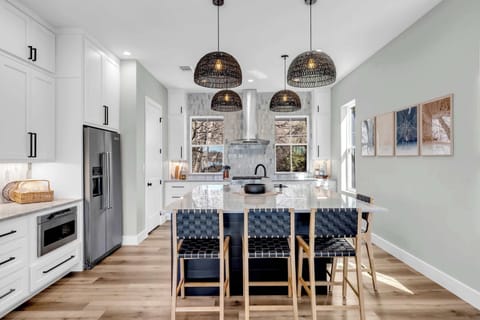 Kitchen has additional seating at the island