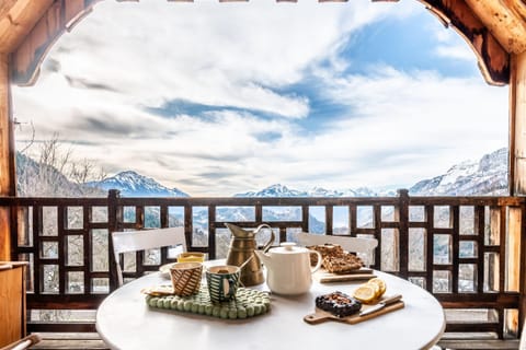 Balcony off the living room in winter with view of the mountains