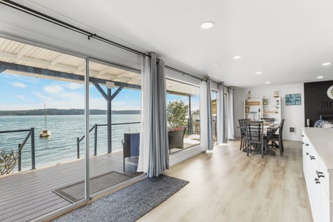 Your views from inside will not disappoint. 3 huge sliders lead out to the deck.