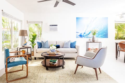 Unwind in this inviting space featuring abundant natural light, cozy furnishings