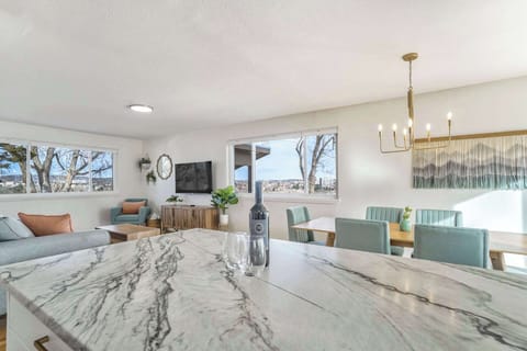 Bar-Like Vibes Await! Gather Around for Memorable Conversations in This Comfortable and Spacious Area.