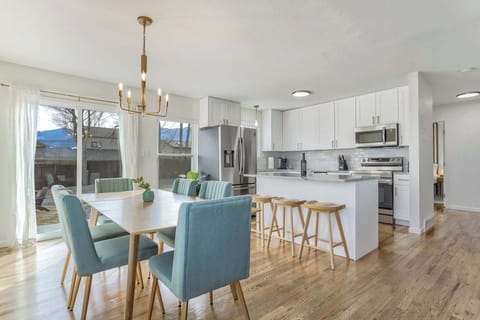 Bright and modern dining space with mountain views—perfect for shared meals and memories!