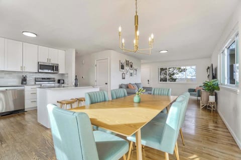 Gather 'Round in Style! Our Dining Area Showcases a Stunning Table with Plenty of Seating. Perfect for Conversations or a Delicious Meal.