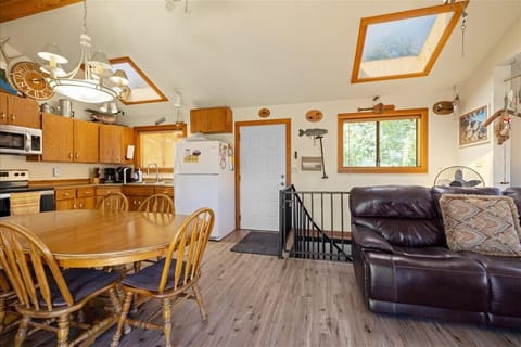 Beautiful skylight windows and staircase access to downstairs guest space.