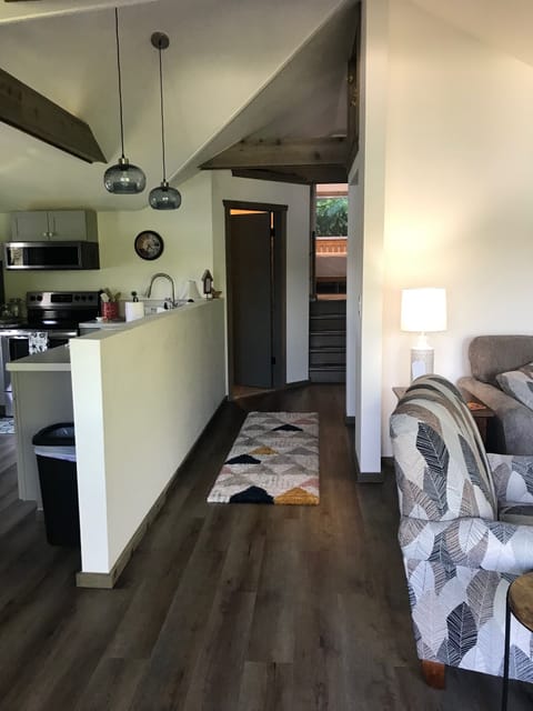 hallway back to the bathroom and lofted bedroom area