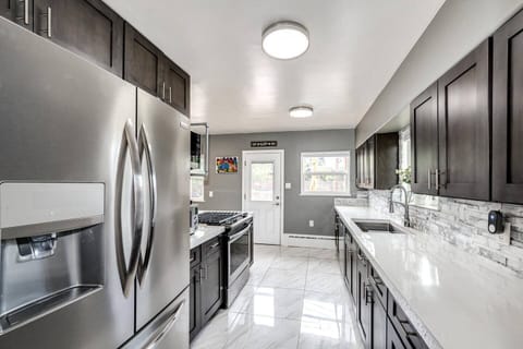 The kitchen is spacious and well-lit. You will enjoy cooking here!