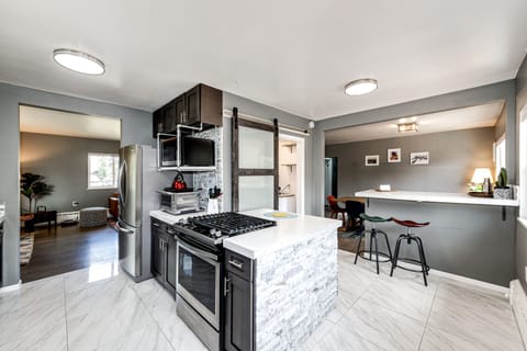 A view of the kitchen and the bar